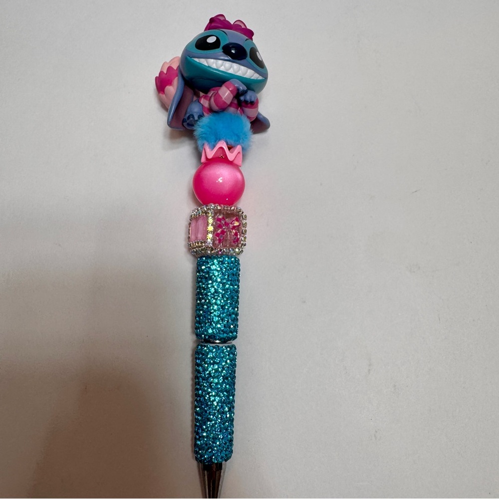 handmade Disney Stitch Cheshire Cat beaded pen, specifically a "Disney Doorable"